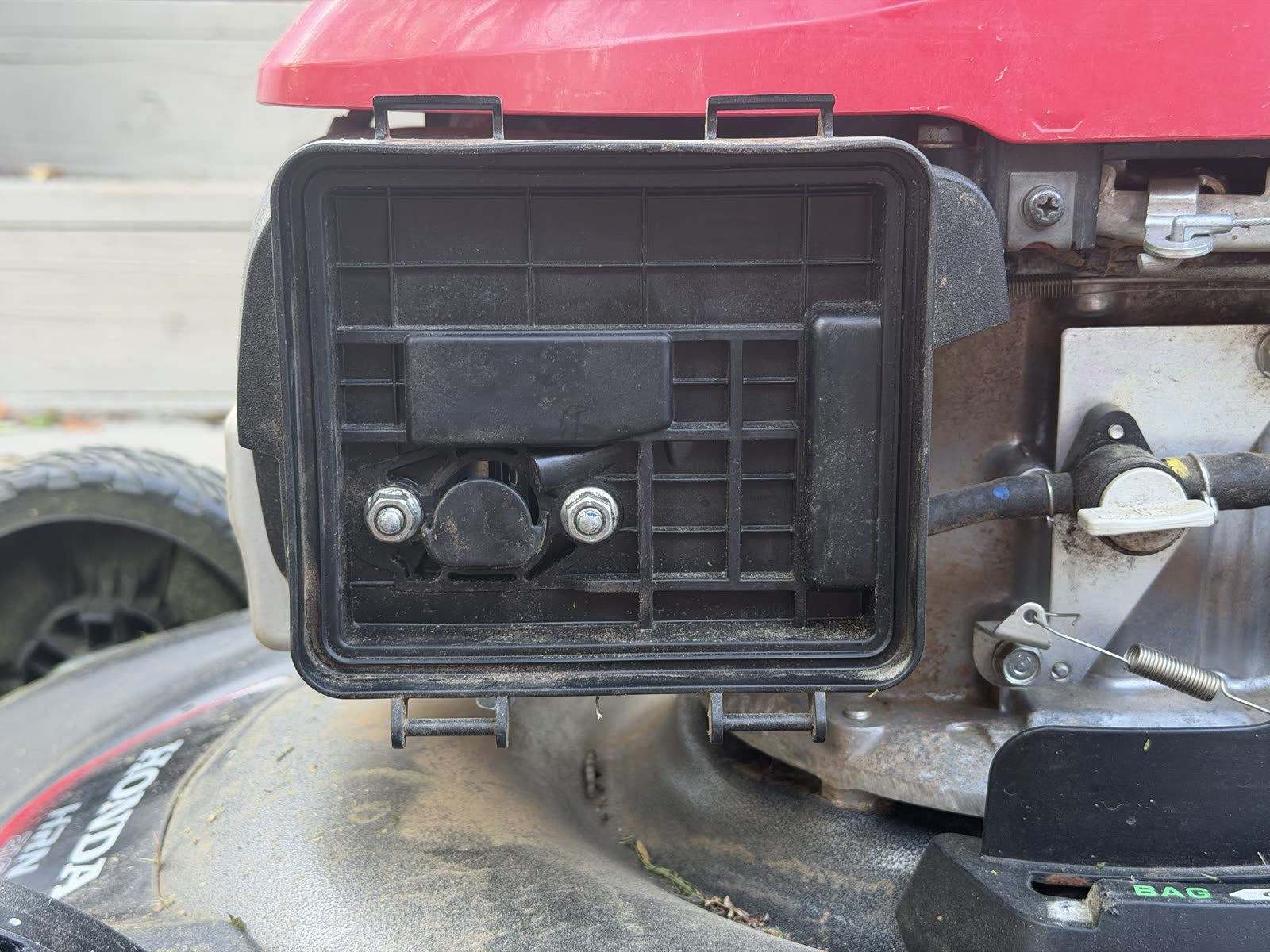 The air cleaner housing reinstalled on the engine