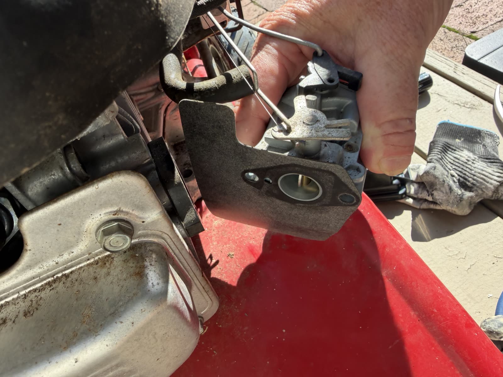 Pulling the old carburetor off the pressure washer engine by hand